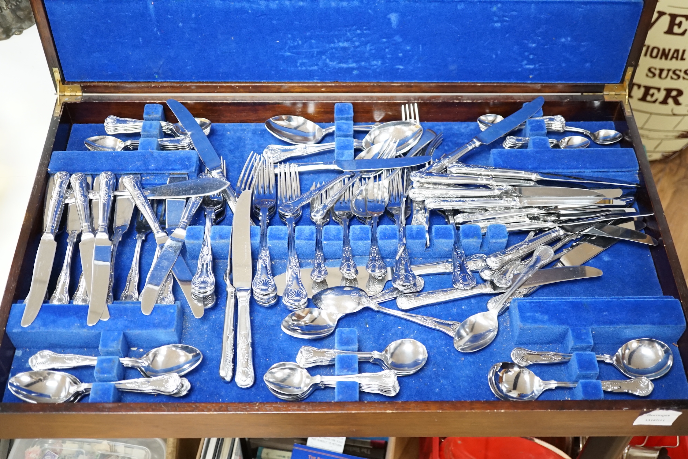 A canteen of plated cutlery with tooled leather top, 77cm wide